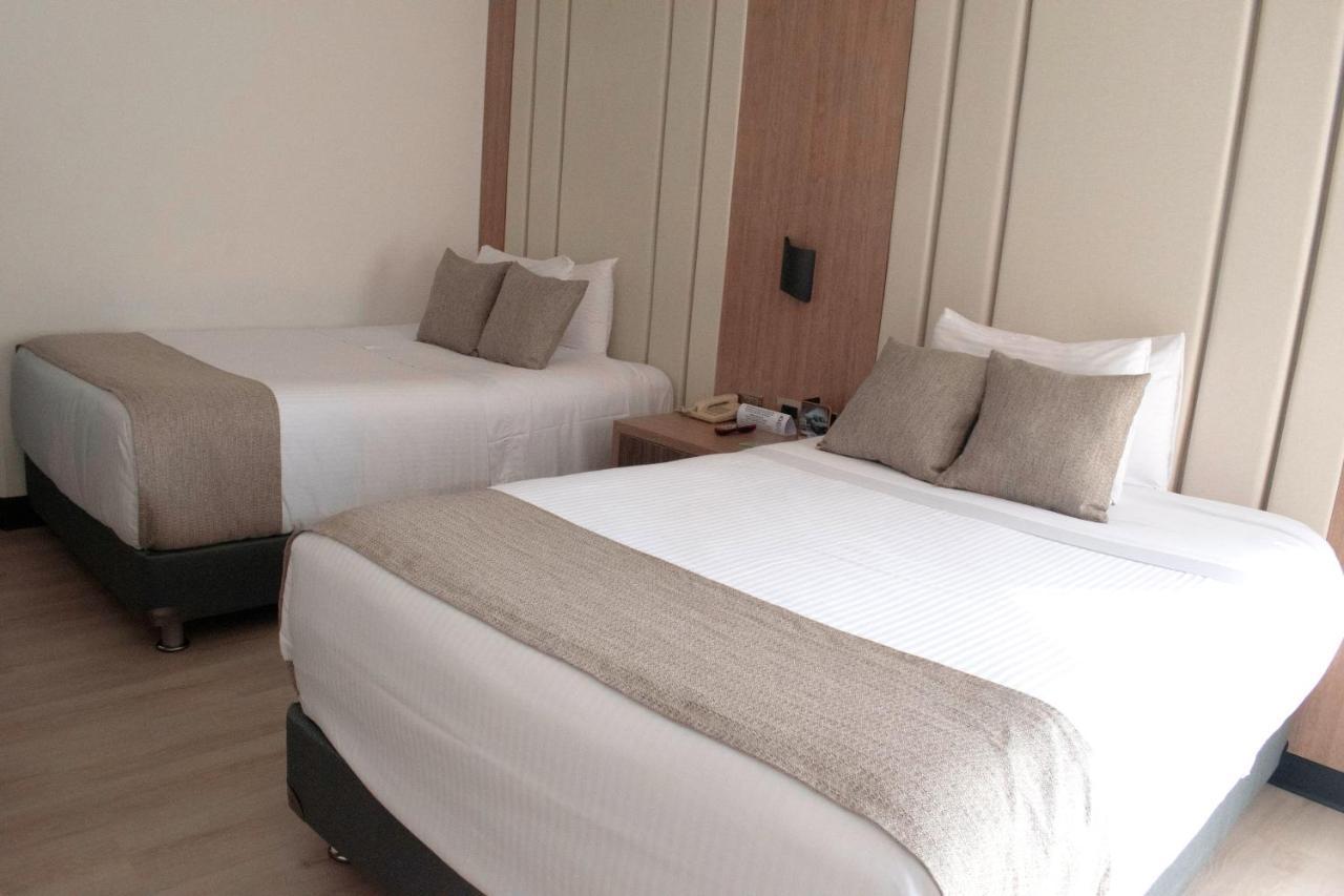 Hotel Dann Carlton Belfort Μεντεγίν Εξωτερικό φωτογραφία A room at the hotel